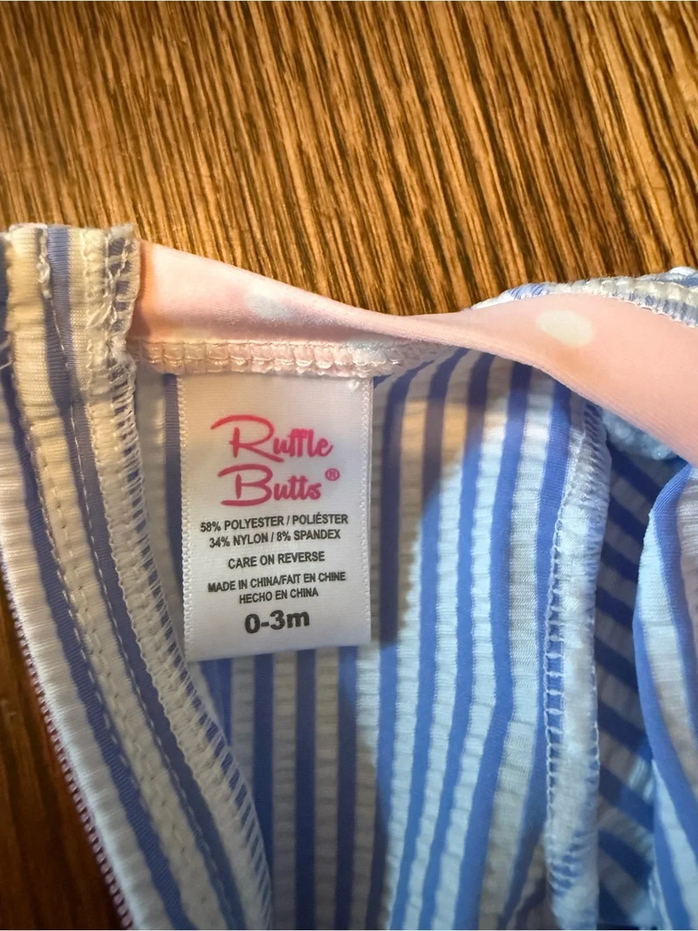 Ruffle Butts Blue and White Striped One-Piece with Pink Trim